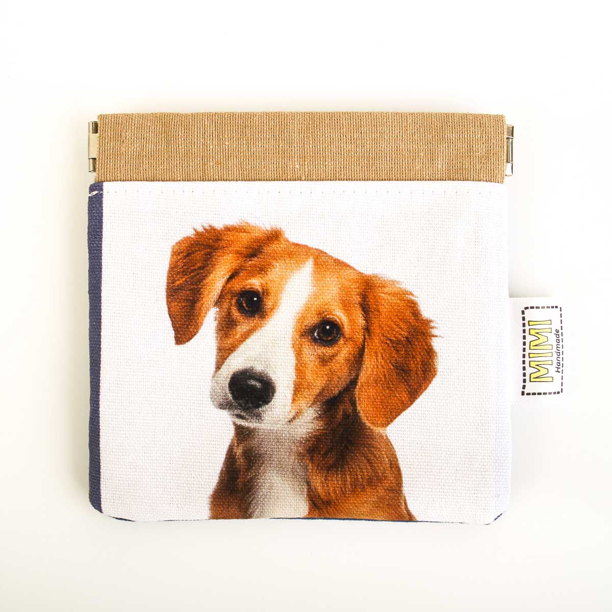 Pouch with a dog's face design on a white background