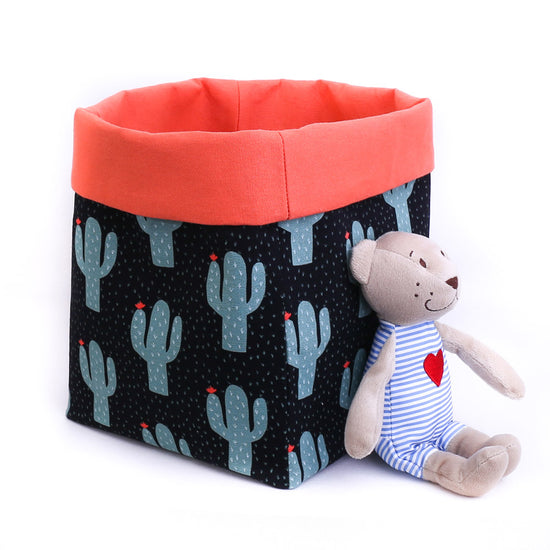 black and orange cactus pattern reversible fabric toy storage bin with teddy bear 