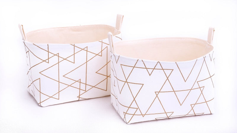 Set-of-two-small-storage-baskets-fabric-white-gold-triangle-print-geometric-homewares