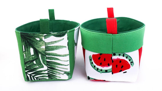 side view of small tropical green storage baskets for kids, made with watermelon and leafy monstera print, by MIMI Handmade Baskets Australia