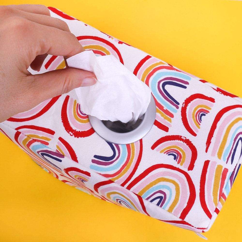 top-view-of-woman-hand-taking-a-tissue-from-a-rectangular-rainbow-tissue-box-on-bright-yellow-background-handmade-in-Australia-by-MIMI-Handmade