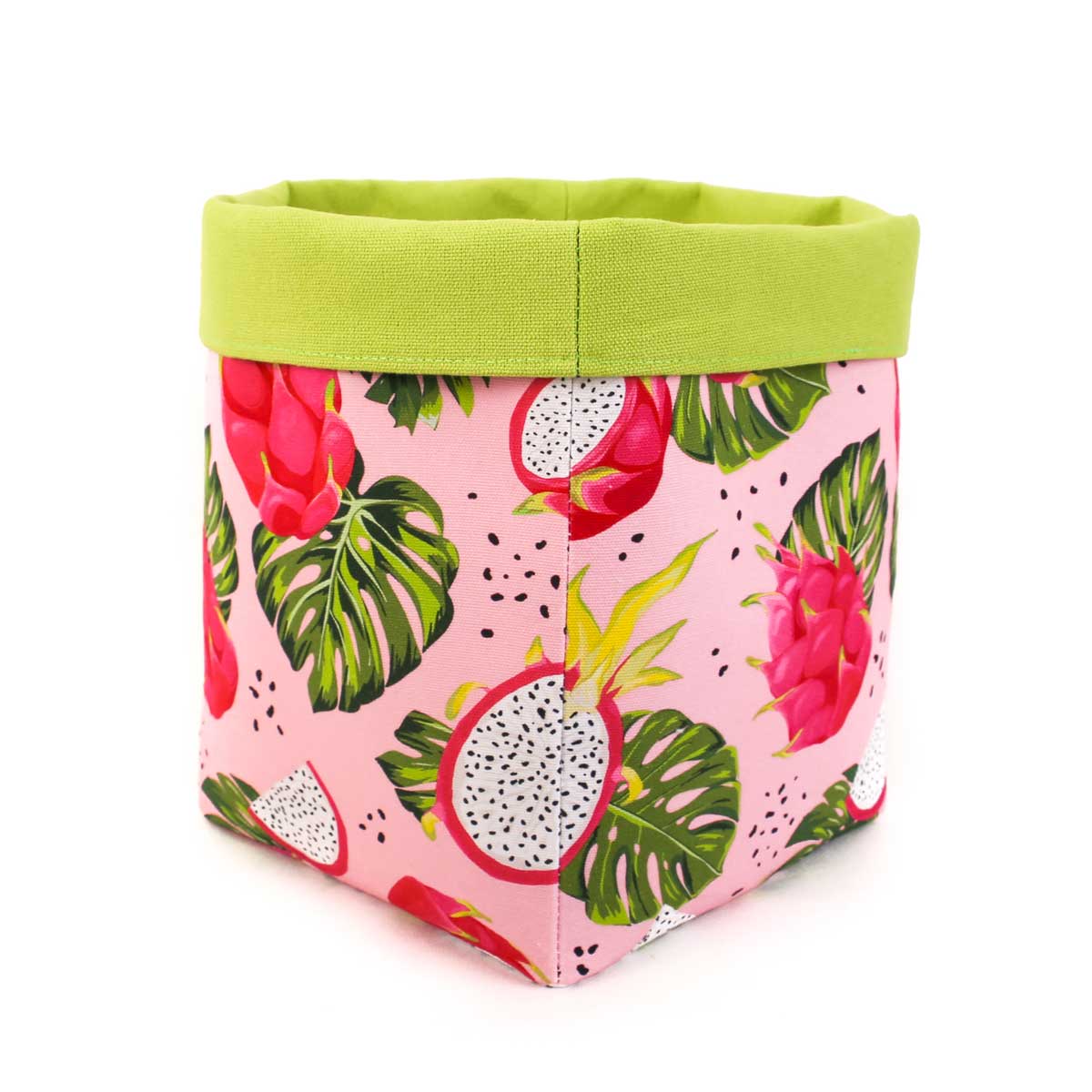 Fabric storage bin with dragon fruit and leaf pattern on a pink background