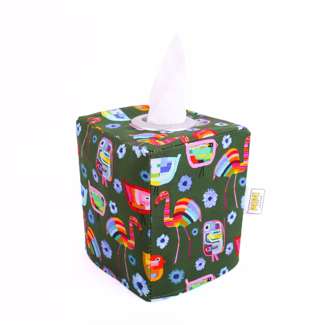Tissue box cover with colourful flamingo design on a green background