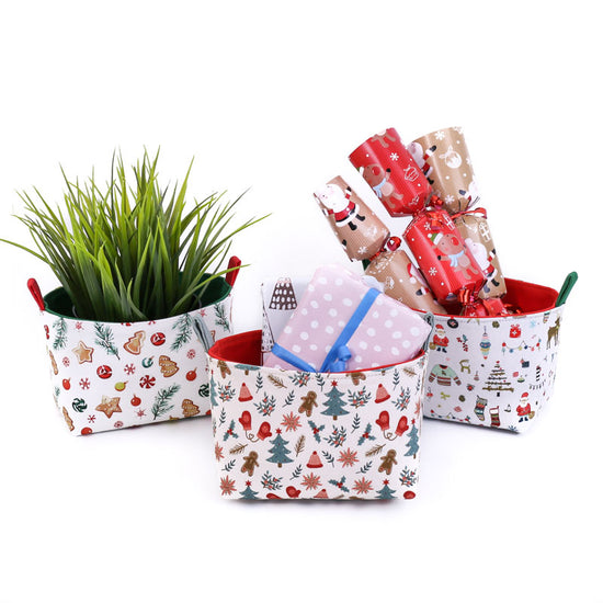 3-small-decorative-Christmas-baskets-with-gifts-plant-and-Christmas-crackers
