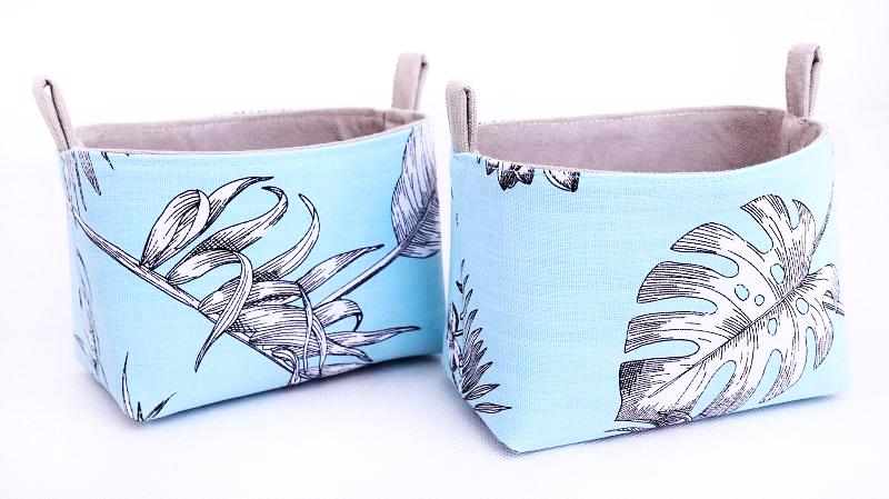Load image into Gallery viewer, set of two blue and grey storage baskets made with botanical monstera leaf fabric handmade by MIMI Handmade
