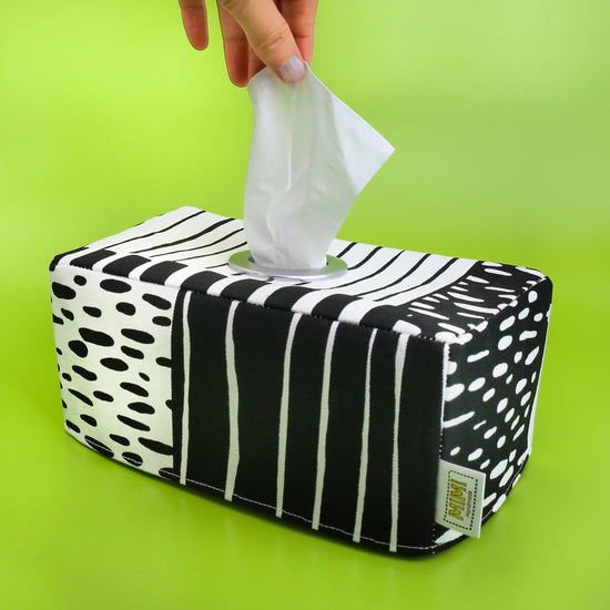black-and-white-geometric-stripes-tissue-box-cover-green-backdrop