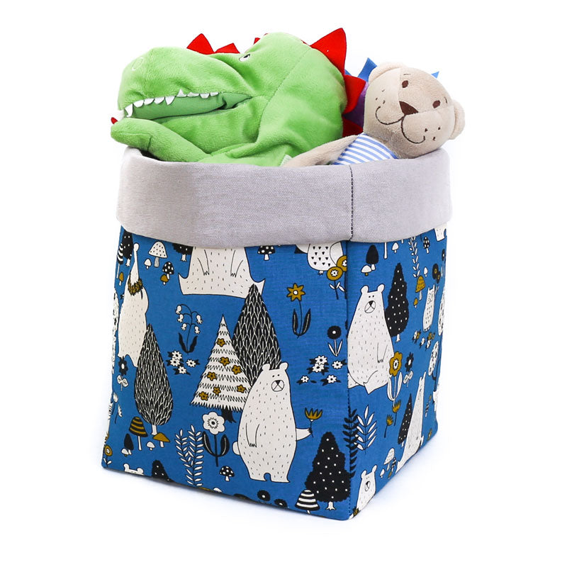 grey-and-navy-blue-woodland-animals-storage-basket-with-soft-toys-inside-the-basket-is-featuring-bear-owl-and-trees