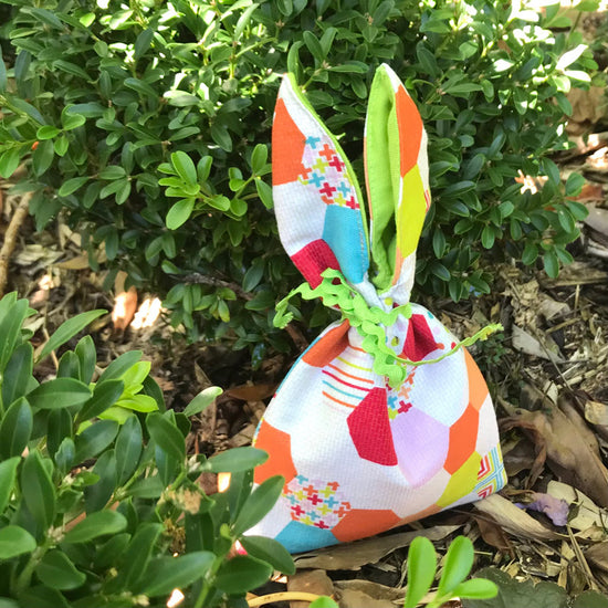colourful-honeycomb-fabric-print-bunny-ear-bag-in-garden