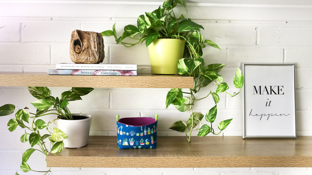 floating-shelves-styled-with-plants-gardening-books-and-a--teal-and-purple-succulents-decorative--basket-handmade-by-MIMI-Handmade.jpg