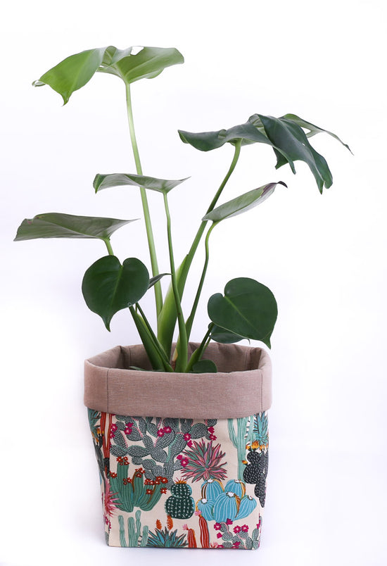 Load image into Gallery viewer, healthy-monstera-deliciosa-plant-in-a-botanical-flowering-cactus-cotton-fabric-plant-pot-holder-lined-with-beige-canvas-handmade-in-Australia-by-MIMI-Handmade
