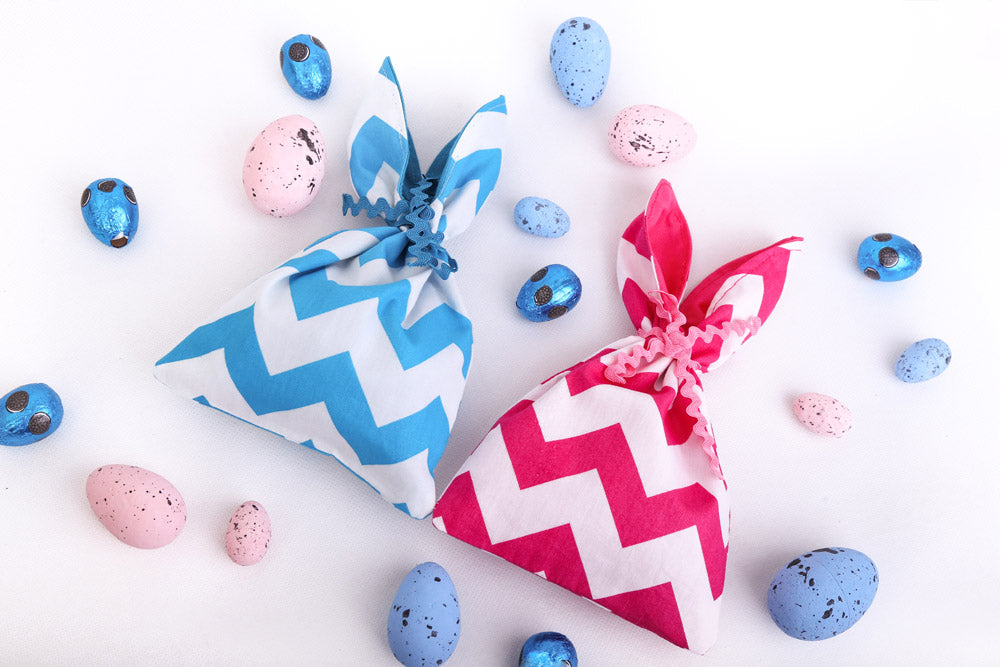 Load image into Gallery viewer, pink-and-blue-zigzag-chevron-bunny-bags-with-small-easter-eggs-chocolate
