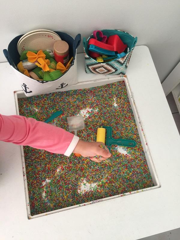 Load image into Gallery viewer, rainbow rice sensory bin pretend play with toy storage baskets by MIMI Handmade Australia
