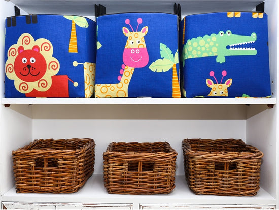cube storage baskets in blue and black for toys in a safari nursery with lion, crocodile, giraffe, handmade by MIMI Handmade Baskets, Australia