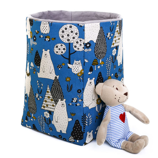 Load image into Gallery viewer, small-IKEA-soft-teddy-bear-toy-placed-against-a-navy-blue-woodland-animals-storage-basket-cube-20cm--featuring-bear-owl-and-tree-print-design
