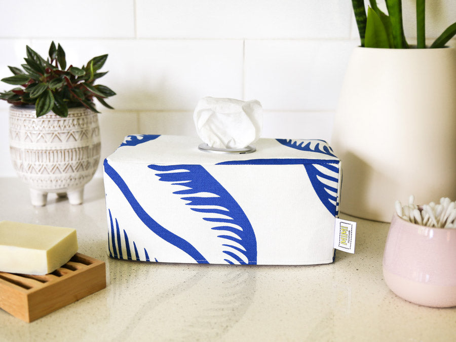 Blue and white store tissue box cover